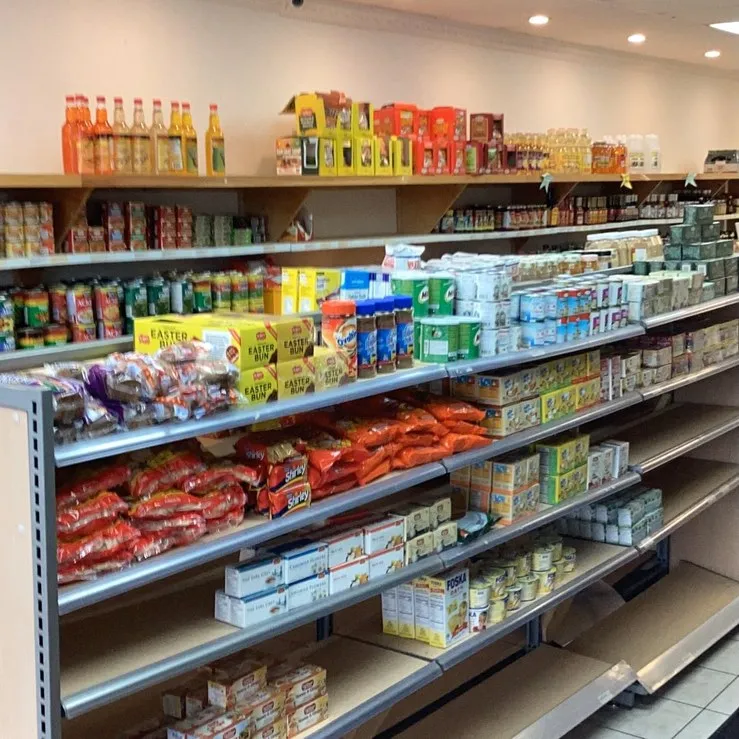 Grace Quisine grocery shelf stocked with Caribbean pantry staples